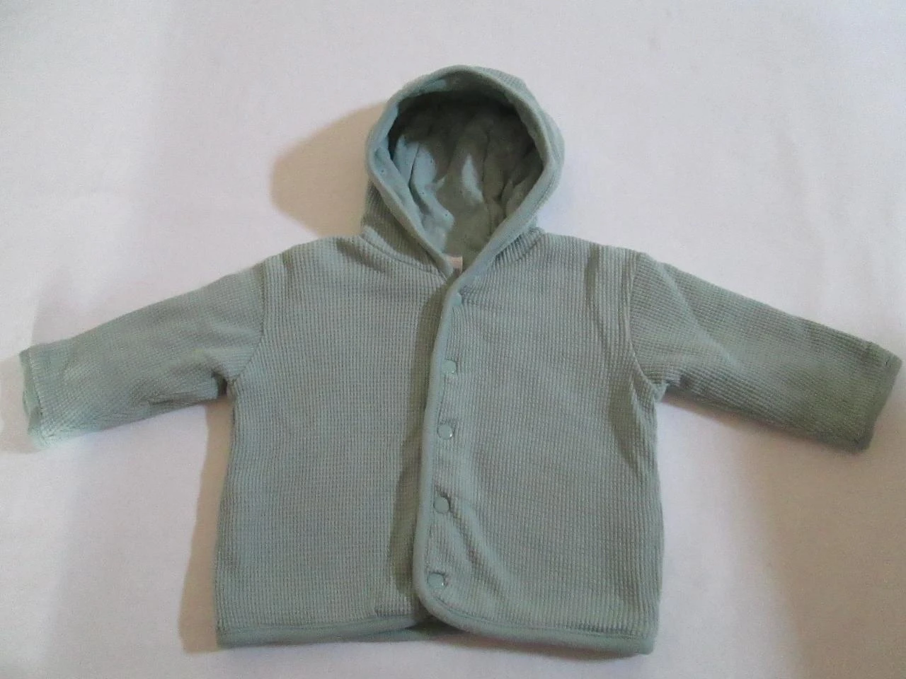 veste verte molletonnée à capuche